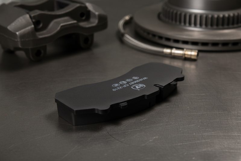 Heavy-duty brake pad friction formulation close-up in factory
