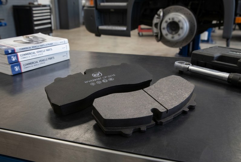 Commercial vehicle truck brake pad replacement inspection with disc brake caliper