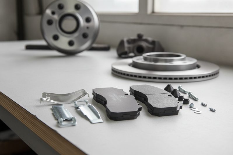 DAF disc brake pad installed in caliper showing how to choose DAF brake pad supplier criteria