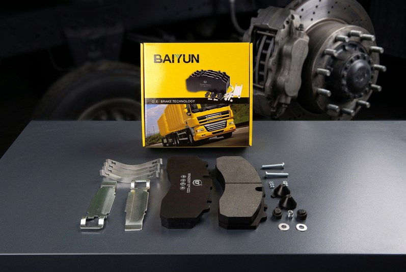 Heavy truck disc brake caliper with ceramic brake pads installed
