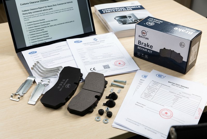 Brake pad supplier documentation checklist with ECE R90 and IATF 16949 certificates on a workbench