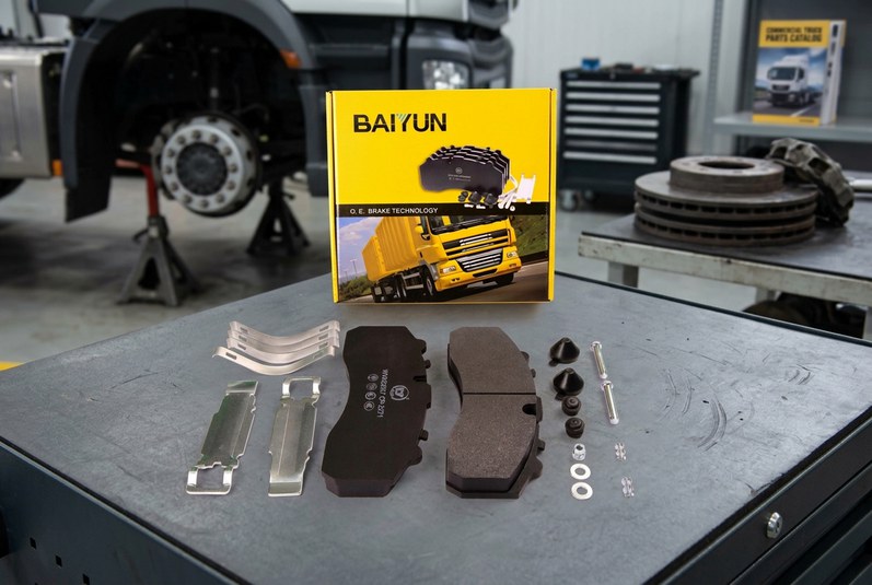 Commercial truck brake pads installed in a heavy-duty air disc caliper